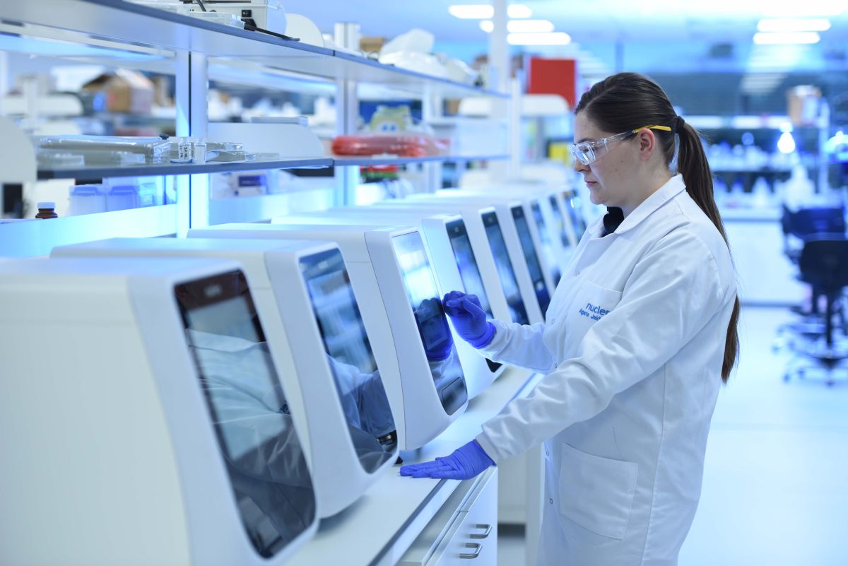 Image shows Nuclera employee working with benchtop eProtein Discovery™ instrument